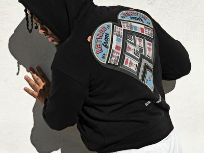 Person practicing tree pose against a dark background